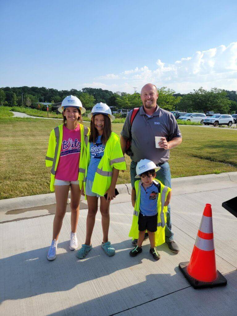 Bring Your Kids to Work Day - Travis Clark and family posing with PPE